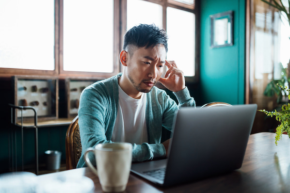 person using laptop to prepare their wordpress website for a high traffic event